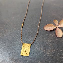 Hand-stamped talisman necklace River Song jewelry shop boston sowa gift shop gold 24k boutique