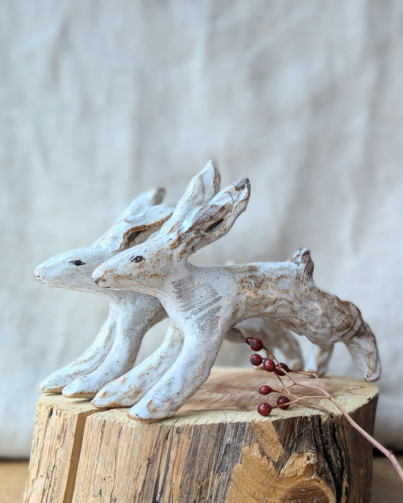 Handmade and hand-painted running rabbit ceramic sculptures by Charlotte salt sowa Boston gift shop boutique store small business