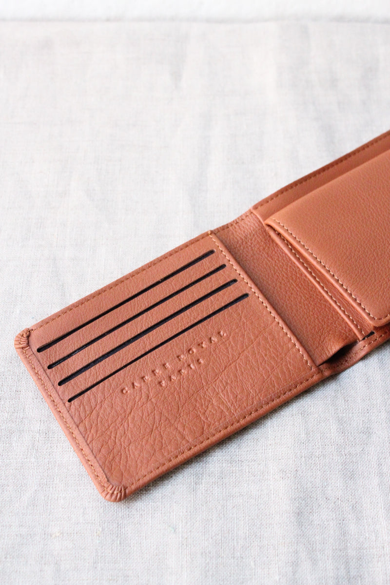 Carre Royal Minimalist Wallet has card slots, multipurpose pockets, and a note compartment. Waterproof calfskin and vegetal tanned leathers. Made in France.