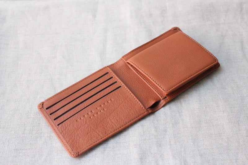 Carre Royal Minimalist Wallet has card slots, multipurpose pockets, and a note compartment. Waterproof calfskin and vegetal tanned leathers. Made in France.